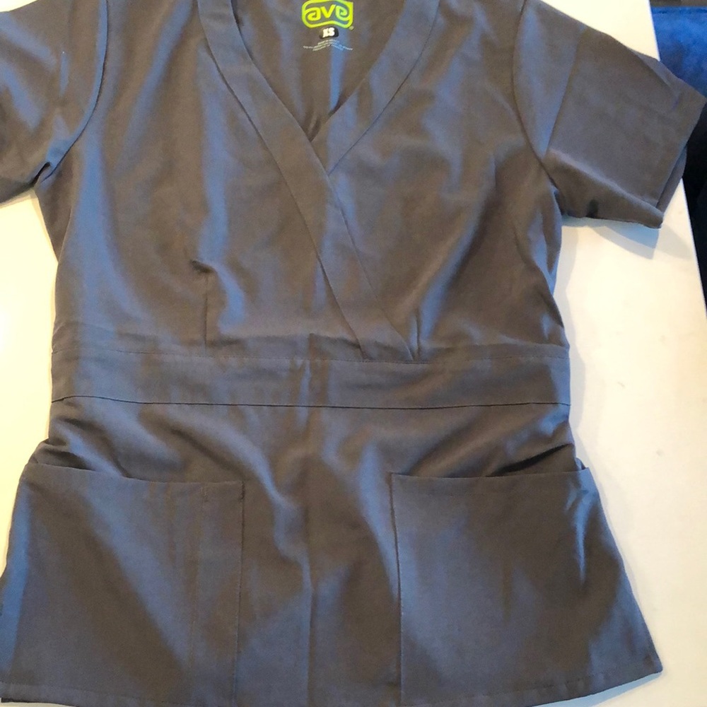 Two Grey sets of scrubs XS top XS reg pants.  2 tops and 2 bottoms total.